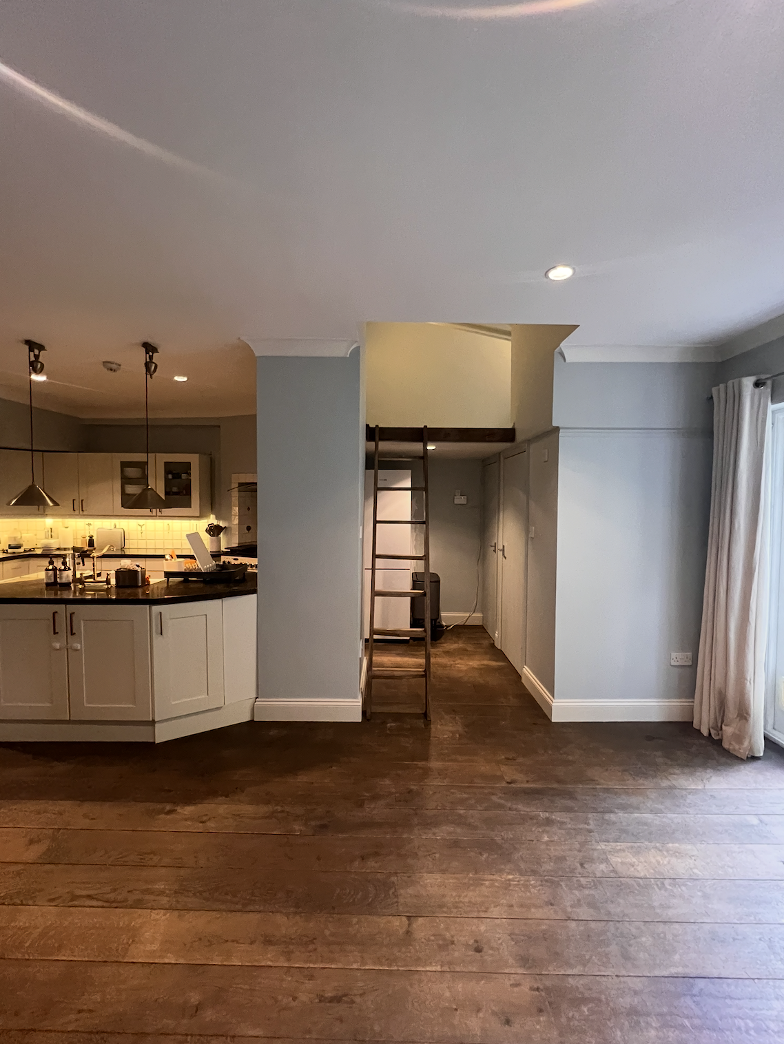 Before: the closed-off kitchen and empty living space