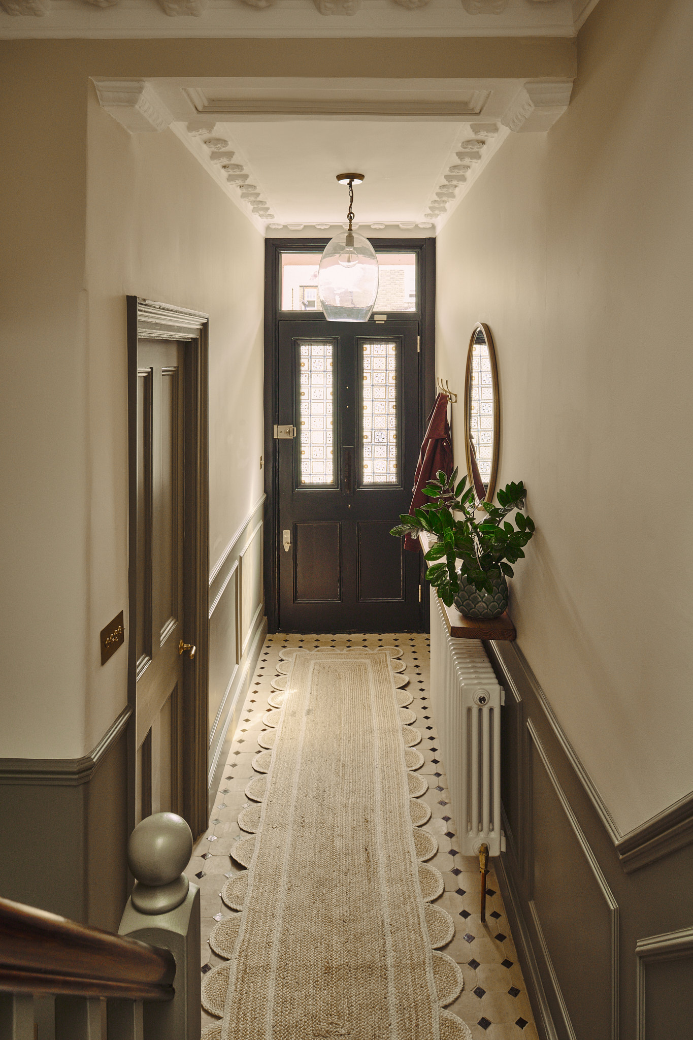 The hallway, with original tiled floor and panelling