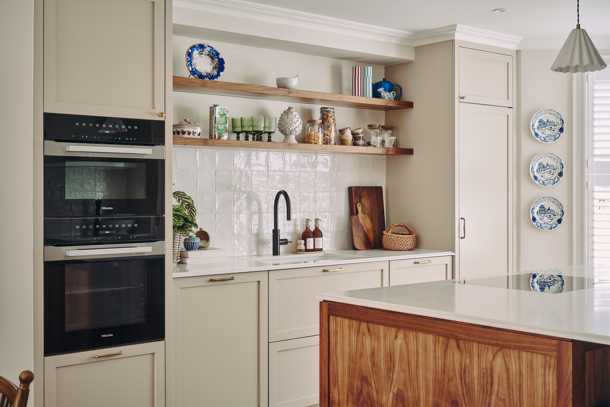 The kitchen, with walnut island and open shelving